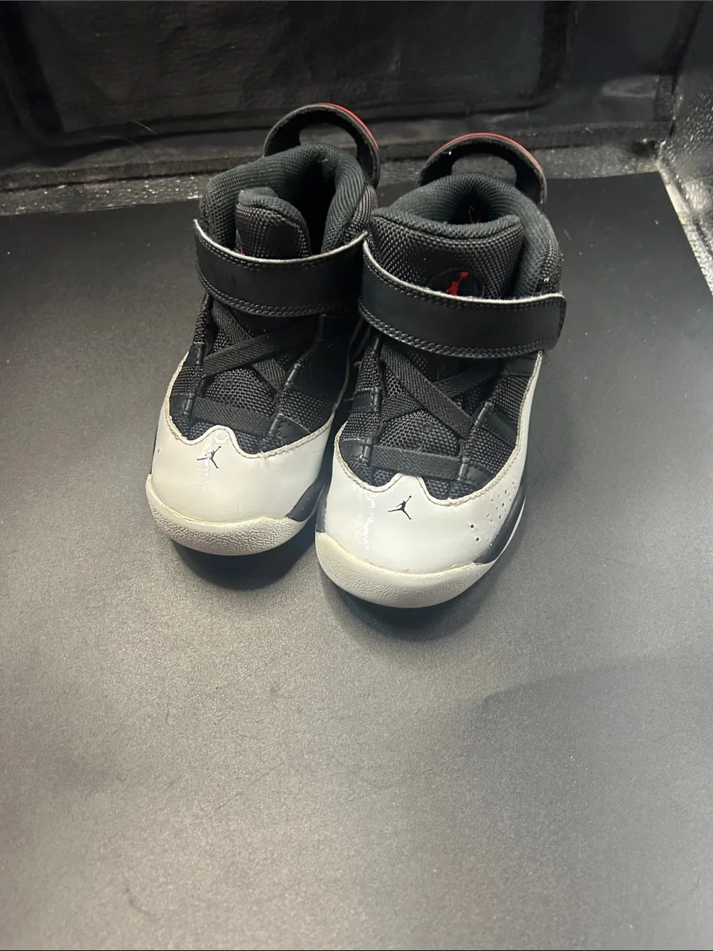 Nike Kids Black and White High-Top Sneakers with Red Accent